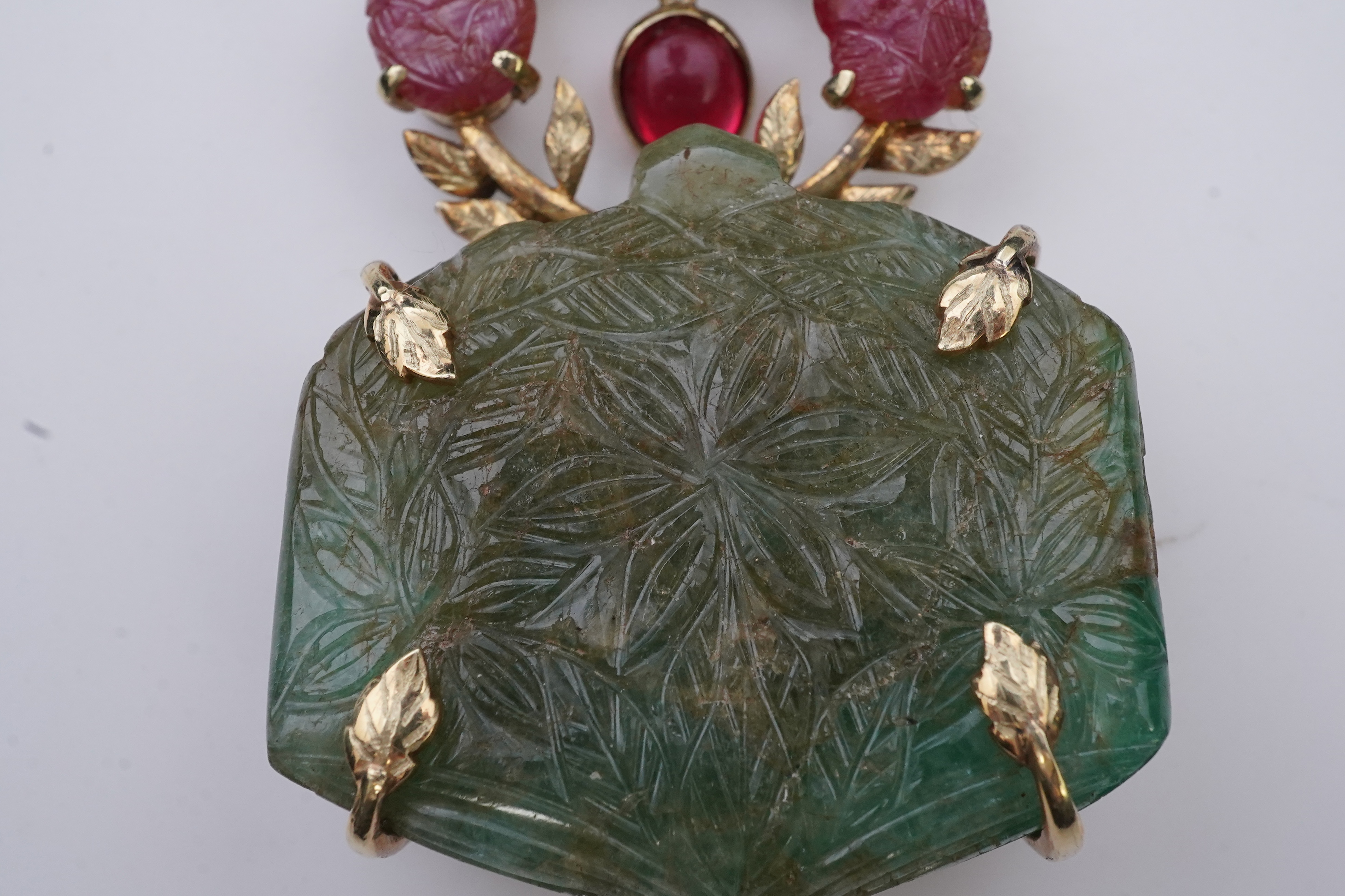 An unusual Mughal-style emerald, ruby and synthetic ruby pendant, second half 20th century